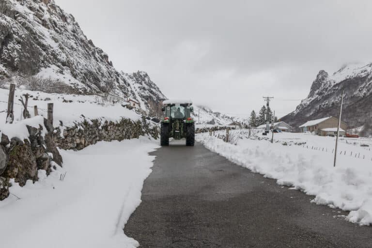 View of a snow tractor clearing the road after a snowstorm